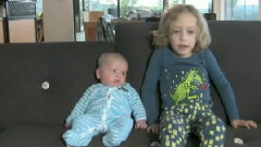 Baby Unimpressed With Older Brother's Singing