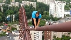 Dude Walking On Top Of Tall Crane